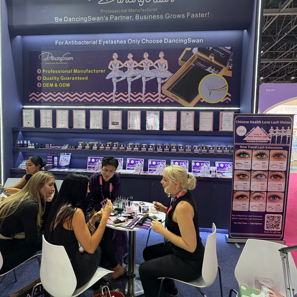 DancingSwan team networking with clients at eyelash trade fair
