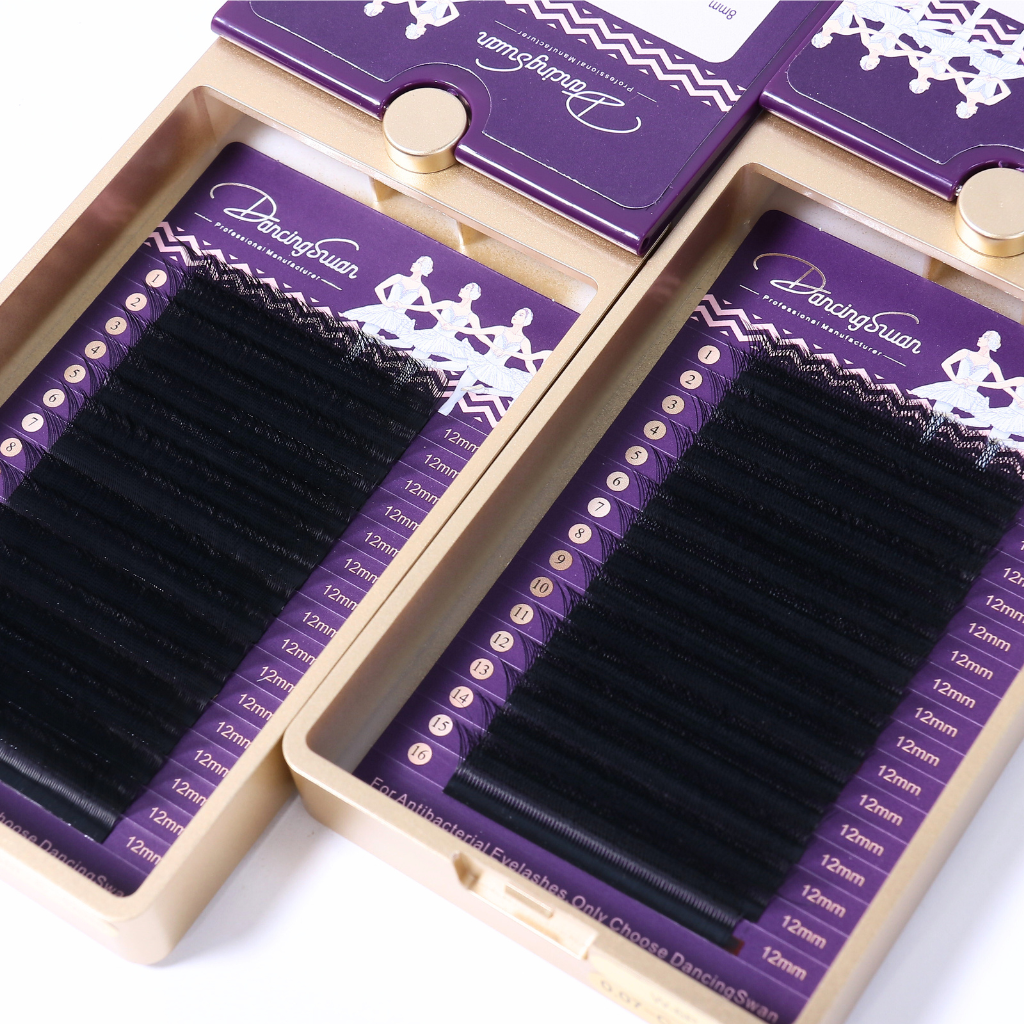 Multiple trays of YY pre-made fan lash extensions with customizable packaging