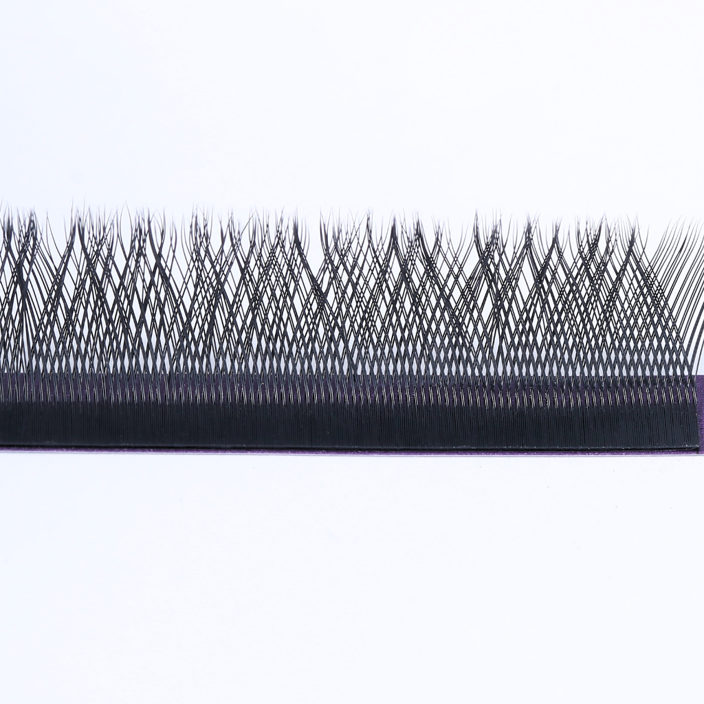 Close-up of 12mm YY pre-made fan lash extensions showing fine PBT fibers