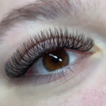 Client eyes with YY eyelash extensions demonstrating thick dense lashes and elegant finish