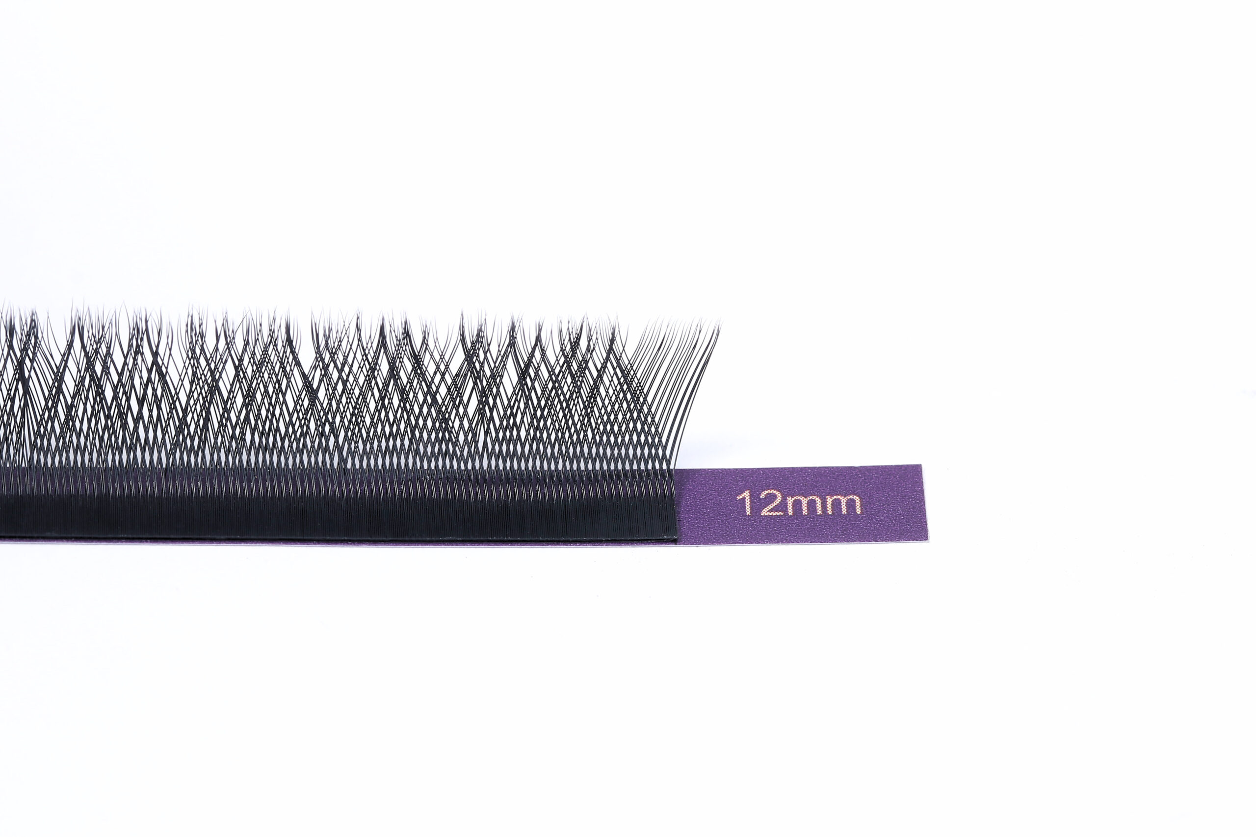 Close-up of 12mm YY pre-made fan lash extensions with double-tipped design