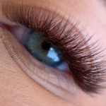 Brown eyelash extensions showing natural volume and curl
