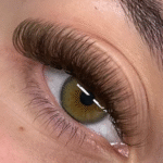 Brown eyelash extensions with long-lasting curl and lift